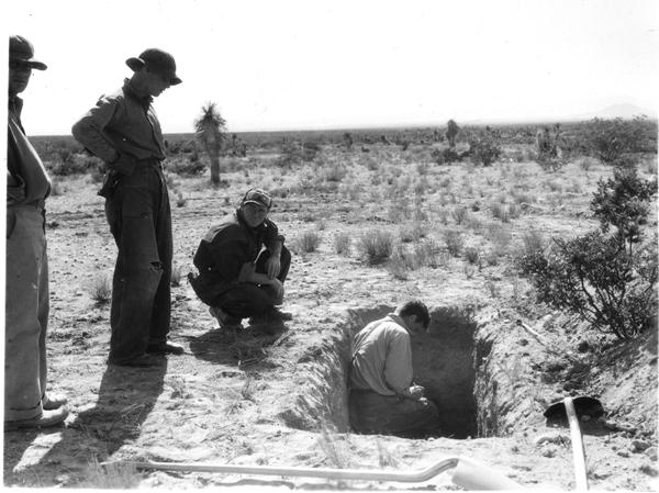 Men digging a soil pit